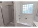 Bathroom with a shower and separate tub under a frosted window allowing privacy and natural lighting at 359 Harbour Reef Dr., Myrtle Beach, SC 29588