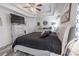 Large bedroom featuring wood-look floors, a decorative ceiling fan, and a dresser with mounted TV and storage at 359 Harbour Reef Dr., Myrtle Beach, SC 29588