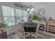 Cozy dining area has a large window providing ample natural light and a stylish light fixture above the table at 359 Harbour Reef Dr., Myrtle Beach, SC 29588