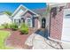 A front entrance showcases a well manicured garden that leads up to the front door at 359 Harbour Reef Dr., Myrtle Beach, SC 29588