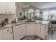 Well-lit kitchen showcases modern stainless steel appliances and natural light from windows, and white cabinets at 359 Harbour Reef Dr., Myrtle Beach, SC 29588