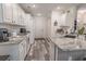 Efficient kitchen design with white cabinets, granite countertops, modern appliances, and wood flooring at 359 Harbour Reef Dr., Myrtle Beach, SC 29588