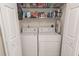 Convenient laundry area features a stacked washer and dryer, with storage shelving to help keep things organized at 359 Harbour Reef Dr., Myrtle Beach, SC 29588
