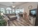 Open-concept living space featuring hardwood floors and natural lighting, that joins the kitchen and dining area at 359 Harbour Reef Dr., Myrtle Beach, SC 29588