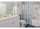 Cozy bathroom featuring a shower-tub combination, white vanity, and decorative shower curtain at 3676 Clay Pond Village Ln. # 4, Myrtle Beach, SC 29579