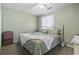 Comfortable bedroom with neutral green walls, plush bedding, and bright natural lighting at 3676 Clay Pond Village Ln. # 4, Myrtle Beach, SC 29579