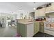 Open kitchen with white appliances and decorative light green lower cabinets offers a welcoming space at 3676 Clay Pond Village Ln. # 4, Myrtle Beach, SC 29579