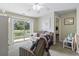 Cozy living room with a sliding glass door offering serene water views and natural light at 3676 Clay Pond Village Ln. # 4, Myrtle Beach, SC 29579