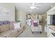 Open-concept living area with a cozy sofa and chairs, seamlessly connected to the dining and kitchen spaces at 3676 Clay Pond Village Ln. # 4, Myrtle Beach, SC 29579