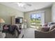 Relaxing living area with a large sliding glass door showcasing beautiful water views and bright natural light at 3676 Clay Pond Village Ln. # 4, Myrtle Beach, SC 29579
