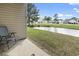 Relaxing patio area with scenic views of the pond, lush green lawn, and surrounding neighborhood at 3676 Clay Pond Village Ln. # 4, Myrtle Beach, SC 29579