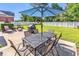 Spacious backyard featuring a patio with an outdoor dining set and barbecue grill, perfect for entertaining at 3736 Kingsley Dr., Myrtle Beach, SC 29588