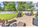 Serene backyard with well-maintained lawn, patio, grill, and ample seating, perfect for relaxation and outdoor dining at 3736 Kingsley Dr., Myrtle Beach, SC 29588
