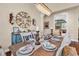 Charming dining area with hardwood floors, elegant table setting, decorative mirror, and chandelier at 3736 Kingsley Dr., Myrtle Beach, SC 29588