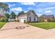 Spacious driveway leading to a two-car garage with well-maintained landscaping at 3736 Kingsley Dr., Myrtle Beach, SC 29588