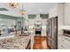Modern kitchen with granite countertops, stainless steel appliances, and ample cabinet space at 3736 Kingsley Dr., Myrtle Beach, SC 29588
