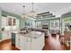 Open-concept kitchen flows into living area with granite island and plenty of room for entertaining at 3736 Kingsley Dr., Myrtle Beach, SC 29588