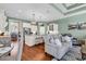Open concept living and kitchen area featuring hardwood floors, white cabinets and marble countertops at 3736 Kingsley Dr., Myrtle Beach, SC 29588