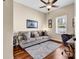 Cozy living space with a plush gray sofa, decorative pillows, and elegant rug under a ceiling fan at 3736 Kingsley Dr., Myrtle Beach, SC 29588