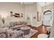 Spacious living room with high ceilings, hardwood floors, and comfortable seating arrangement with natural light at 3736 Kingsley Dr., Myrtle Beach, SC 29588