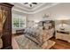 Cozy main bedroom with hardwood floors, tray ceilings, a large window, and neutral paint at 3736 Kingsley Dr., Myrtle Beach, SC 29588
