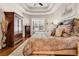 Well-lit main bedroom featuring hardwood floors, tray ceilings, a large window, and a closet at 3736 Kingsley Dr., Myrtle Beach, SC 29588