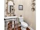 Elegant powder room with decorative mirror, marble countertop, and silver accents creating a stylish space at 3736 Kingsley Dr., Myrtle Beach, SC 29588