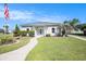 Charming community clubhouse features a well-manicured lawn and landscaping and a welcoming walkway entrance at 3939 Gladiola Ct. # 202, Myrtle Beach, SC 29588