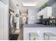 Functional kitchen featuring a breakfast bar, stainless steel appliances, and access to the hallway at 3939 Gladiola Ct. # 202, Myrtle Beach, SC 29588