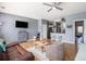 Inviting living room showcasing hardwood floors, an entertainment area, and a view of the kitchen at 3939 Gladiola Ct. # 202, Myrtle Beach, SC 29588