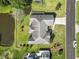 Aerial view of the house, roof, surrounding landscaping, and a nearby pond at 4012 Grousewood Dr., Myrtle Beach, SC 29588