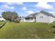 Well-maintained backyard with lush green grass and views of the home's exterior at 4012 Grousewood Dr., Myrtle Beach, SC 29588