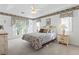 Bedroom featuring a bright window, floral border, ceiling fan, and bedspread at 4012 Grousewood Dr., Myrtle Beach, SC 29588