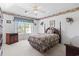 Bedroom has a beautiful view, floral border, ceiling fan, and bedspread at 4012 Grousewood Dr., Myrtle Beach, SC 29588