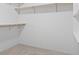 Walk-in closet with white shelving and carpeted floor at 4012 Grousewood Dr., Myrtle Beach, SC 29588