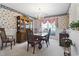 Formal dining room with traditional furniture, floral wallpaper, and elegant lighting at 4012 Grousewood Dr., Myrtle Beach, SC 29588