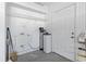 Garage space with utility sink, water filtration system, and door at 4012 Grousewood Dr., Myrtle Beach, SC 29588