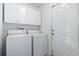 Functional laundry room with white appliances and cabinetry at 4012 Grousewood Dr., Myrtle Beach, SC 29588