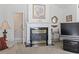 Cozy living room with a fireplace, carpet, and a view into an eat-in kitchen at 4012 Grousewood Dr., Myrtle Beach, SC 29588