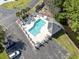 Overhead aerial view of a community pool with surrounding lounge chairs and parking at 4012 Grousewood Dr., Myrtle Beach, SC 29588