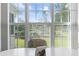 Bright dining area with a picture window overlooking a scenic backyard with a pond and fountain at 4012 Grousewood Dr., Myrtle Beach, SC 29588