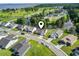The aerial view emphasizes a well-planned neighborhood surrounding a river with homes, landscaping and calm waters at 417 Grain Field Dr., Georgetown, SC 29440