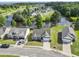 Aerial shot showcases a neighborhood with waterfront properties, lush landscaping, and well-maintained homes at 417 Grain Field Dr., Georgetown, SC 29440