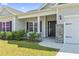 Inviting front entrance with a black door, brick accents, and a well-maintained lawn at 417 Grain Field Dr., Georgetown, SC 29440