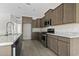 Modern kitchen featuring stainless steel appliances, granite countertops, and ample cabinet space at 417 Grain Field Dr., Georgetown, SC 29440