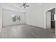 Spacious main bedroom with tray ceiling, a large window, and access to the en-suite bathroom, offering comfort and privacy at 417 Grain Field Dr., Georgetown, SC 29440