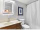 Clean bathroom featuring a single sink vanity and a shower with a curtain at 4206 Pinehurst Circle # E8, Little River, SC 29566