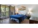 Bright bedroom with a private balcony and modern furnishings at 4206 Pinehurst Circle # E8, Little River, SC 29566
