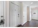 Bright condo hallway with doors leading to individual units and an exit sign at 4206 Pinehurst Circle # E8, Little River, SC 29566