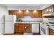 Cozy kitchen features wooden cabinets, modern appliances, and a practical layout at 4206 Pinehurst Circle # E8, Little River, SC 29566